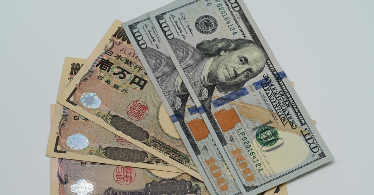 Japanese yen and US dollar banknotes, symbol of currency exchange