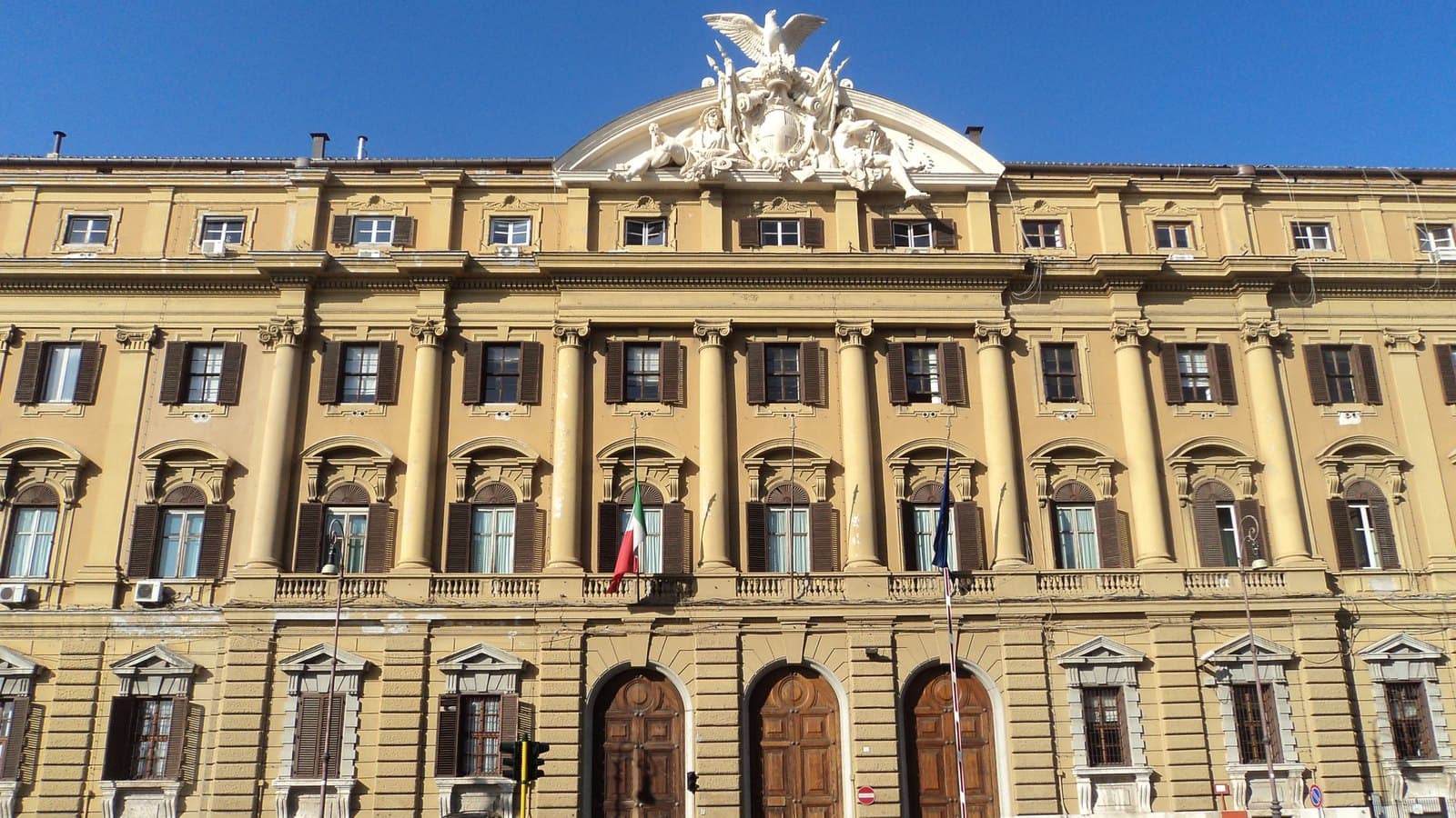 The facade of the Palazzo delle Finanze on Via XX Settembre in Rome, home of the Ministry of Economy and Finance, with the Italian and European flags