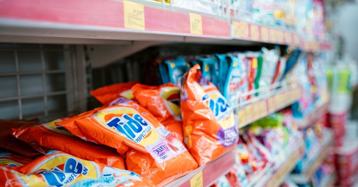 A supermarket shelf with Unilever products on display