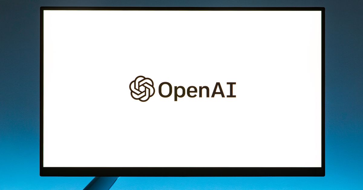 The OpenAI logo displayed in the center of a lit monitor, against a blue background