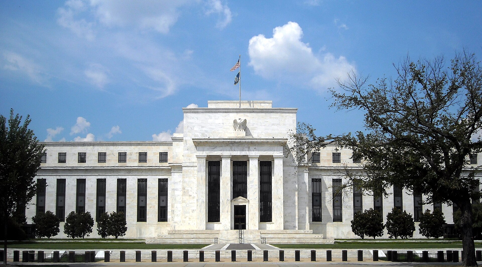 Federal Reserve building in Washington DC with dollar symbol in foreground